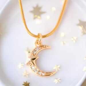 CZ star and moon gold necklace. New.